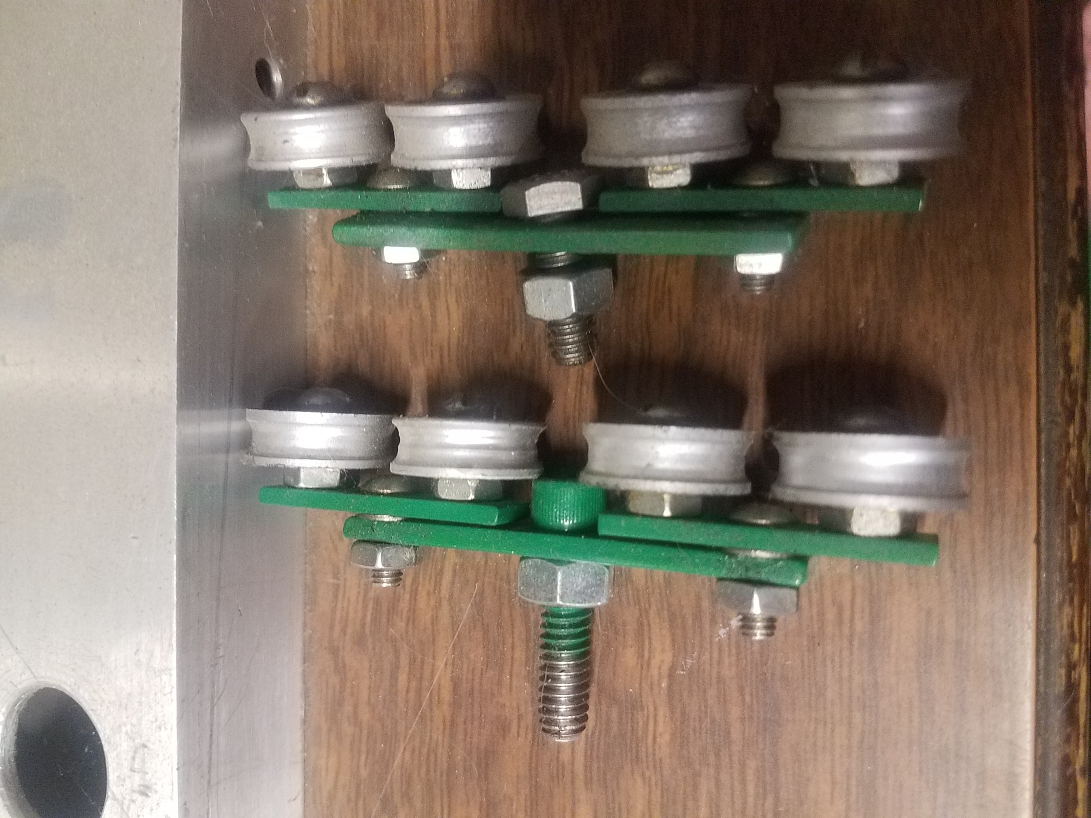 Washers are.015 thick to seperate the 2 rocker arms. Back end of the rollerbattery beam is tapped.