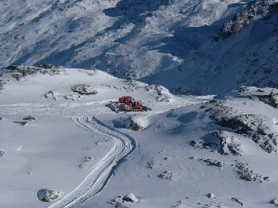 Groomers working of Fuorcla Surlej piste